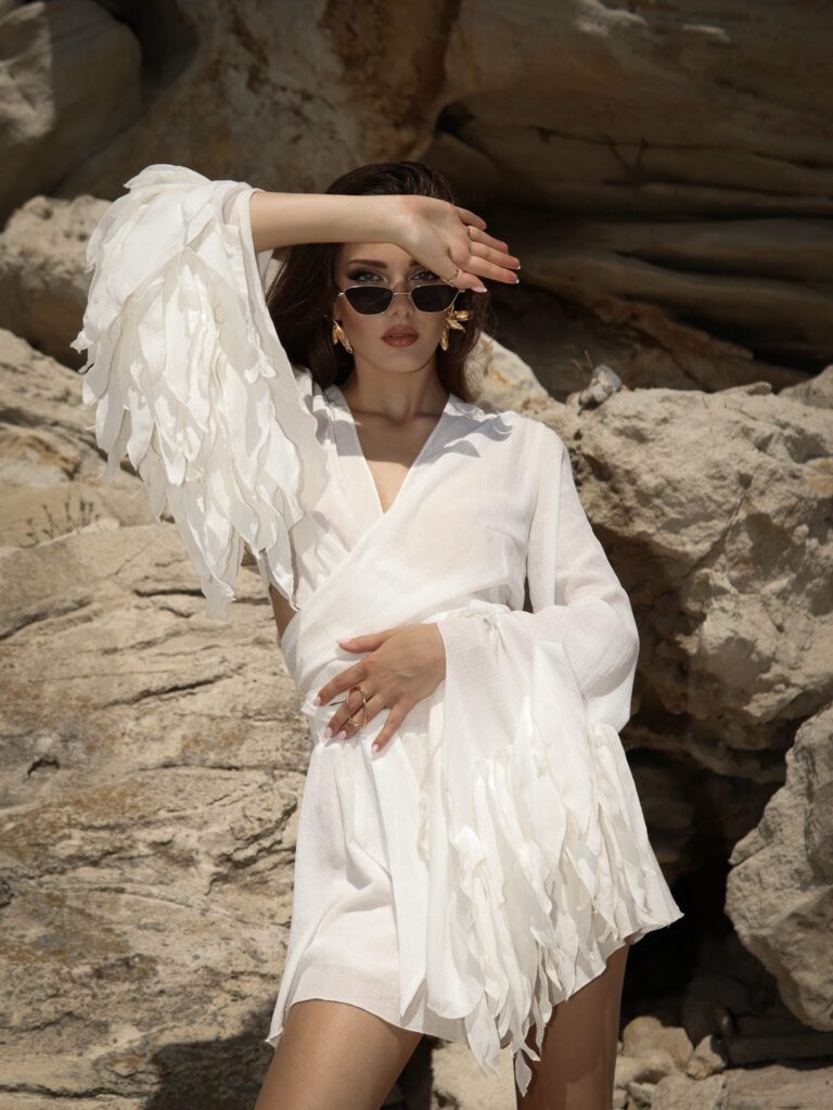 second img: Océlie Ivory Wrap Top